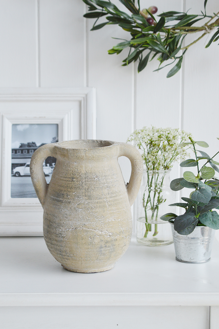 A rusctic grey stone jar with handles. Vintage charm and texture are in abundance with our beautiful piece of stoneware. In a grey stone finish, it is perfect to fill with our faux Eucalyptus or olive stalks. 