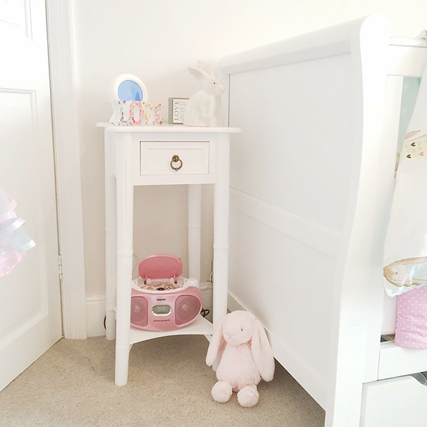 Our New England white bedside table in a nursery
