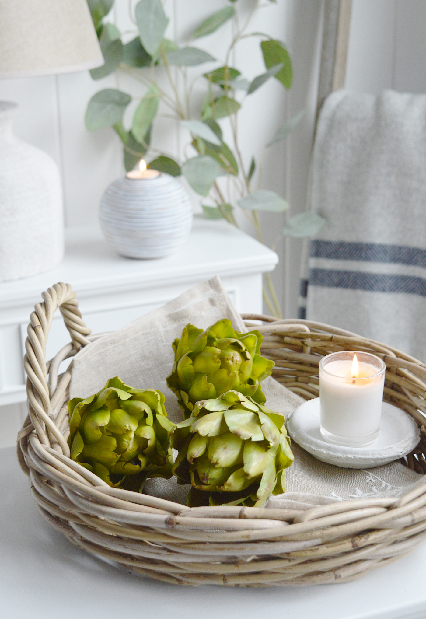 Faux green realisitic artichokes in the Casco Bay basket for Coastal style interiors.