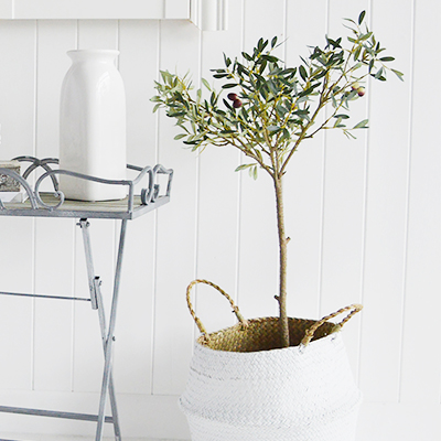 An artificial Olive Tree in a pot. A fabulously gorgeous and realistic artificial Olive Tree in a rustic pot.