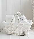 White basket with handles, ideal for storing toilet rolls or toiletries