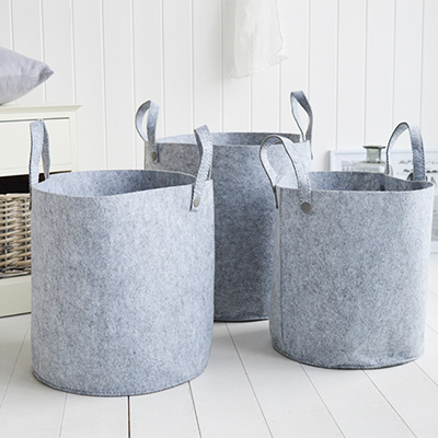 Set of three grey fabric baskets with handles