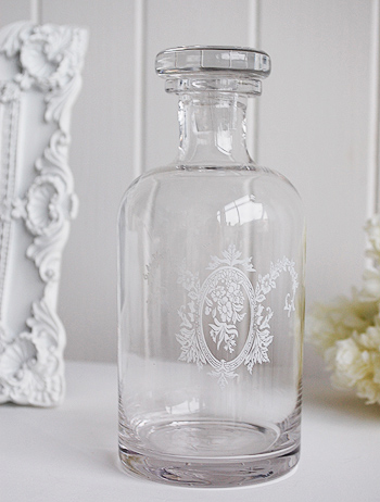 Decorative glass bottle with stopper, ideal for bathroom or bedroom