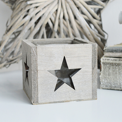 The Nantucket wooden candle holder with glass cup for a candle and a cut out star on all four sides for the candlelight to light up the stars

Our range of Nantucket candle and tea light holders, named after the tiny isolated New England island of Cape Cod, have the unfinished grey and white rustic look you would expect from the New England coast.