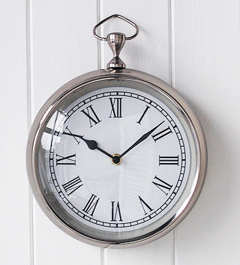 Close view of the chrome wall clock
