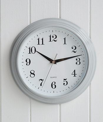 Wall clock in simple pale grey