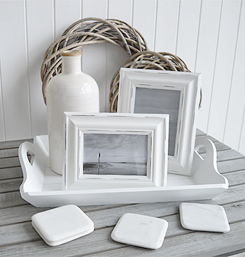 White Home decor accessories - white photo frames and vases