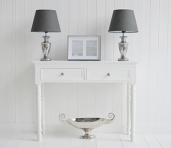 The double photo frame on the white New England Console table