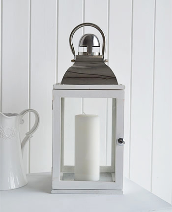 White lantern with silver top and handle