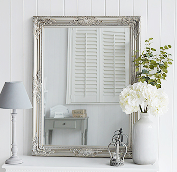 A mirror on your table is a must, we love the look of a large mirror, in this case, a silver mirror, simply resting on the table. 