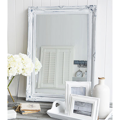 The Versailles large white wall mirror with bevelled glass and a white distressed ornate frame reminiscent of a french chateau. The mirror can be wall hung or simply rest on a table top for dressing or console table.