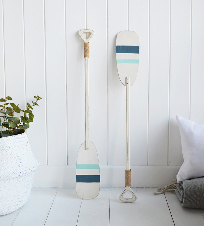 Pair of decorative wooden oars for coastal interiors and home by the sea