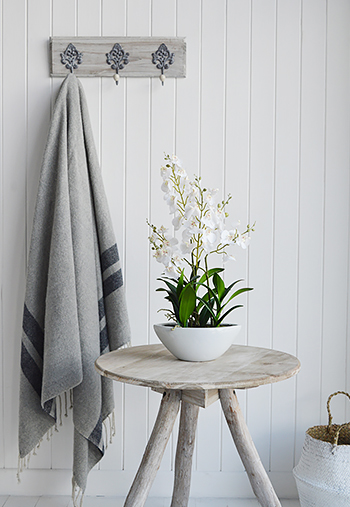 Artificial white orchids in a hallway