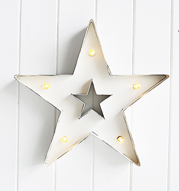 White metal star with lights