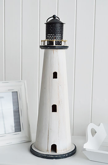 The White Lighthouse tealight holder is a perfect accompanient in a coastal bathroom