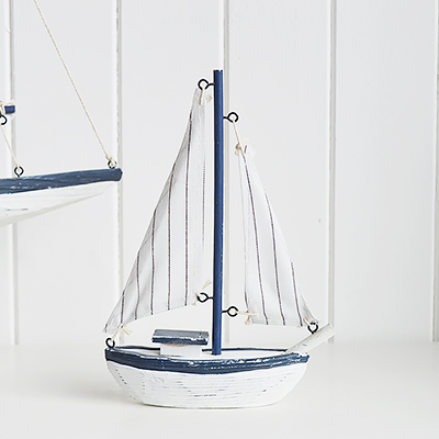 Luxury Chic Coastal nautical decorative accessories for the home by the sea. Small Blue and white yacht