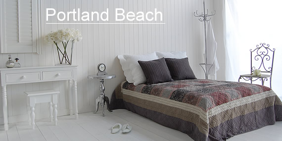 A mix of white and grey bedroom furniture in The Portland bedroom