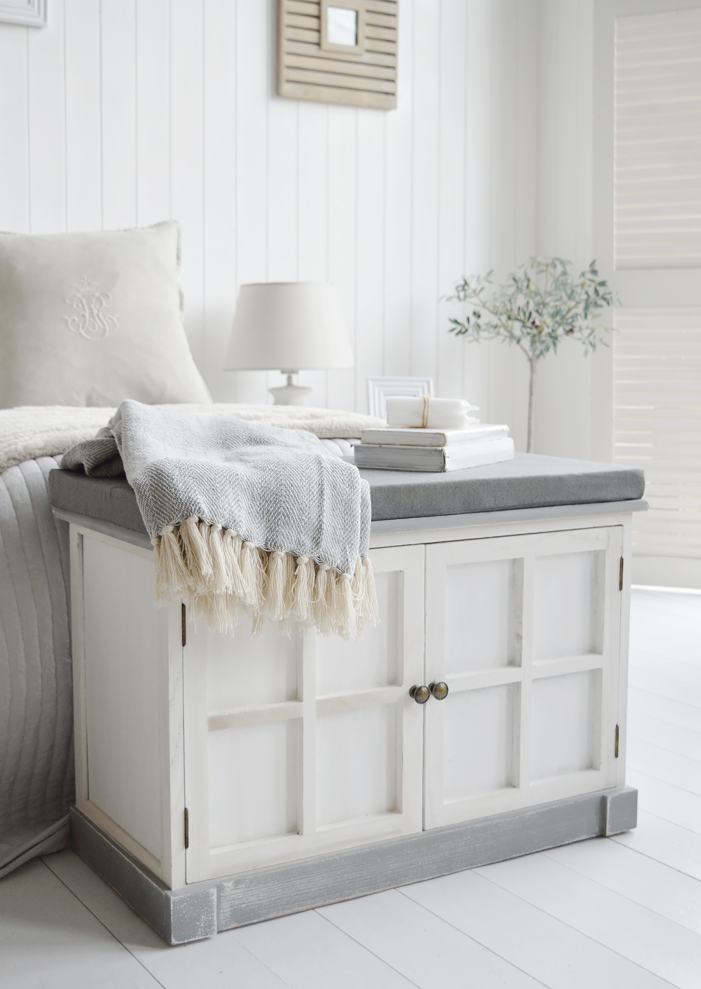 The Charlotte bench in a bedroom at the end of a bed for storage and seating