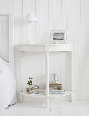 A large white bedside table form The Colonial White range of furniture. Ideal when a lot of space is available in the bedroom