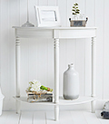 Simple white furniture. White Colonial Hall furniture, a half moon console table