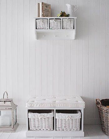 White Storage bench with baskets for white hallway furniture in a beach home