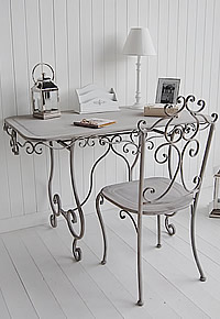 A large frey dressing table with matching chair.