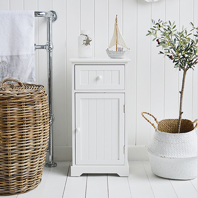 The Maine white bathroom cabinet with a drawer and a shelved cupboard.
The Maine Range is hand painted range of white bathroom furniture with wooden door knobs, a tonge and groove effect design and delivered fully assembled.