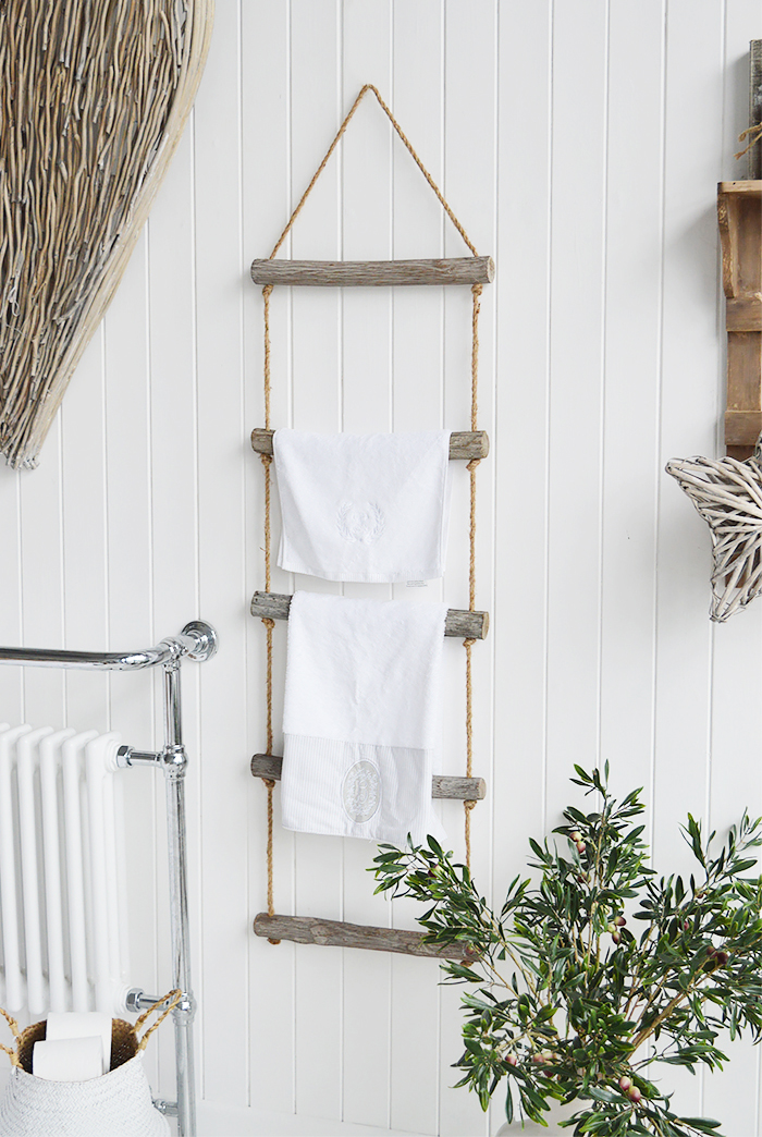 A rope ladder with driftwood effect rungs to hang towels, throws or blakets for a nautical coastal styled room - towel rail. from The White Lighthouse Furniture , New England interiors and furniture for the hallway, living room, bedroom and bathroom