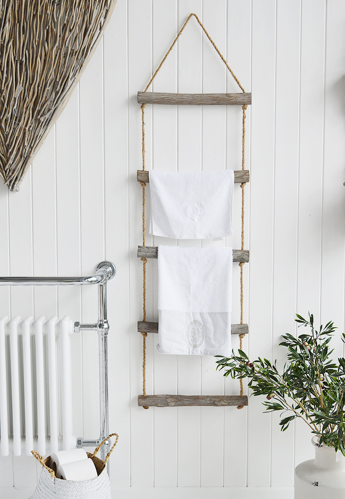 A rope ladder with driftwood effect rungs to hang towels, throws or blankets for a nautical coastal styled bathroom. from The White Lighthouse Furniture , New England interiors and furniture for the hallway, living room, bedroom and bathroom