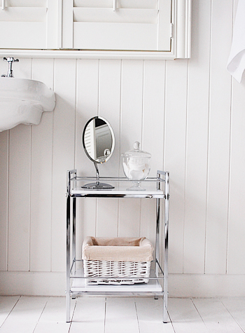 Small white and chrome bathroom shelf unit, ideal for small spaces in a bathroom for storing towels or vanity shelves