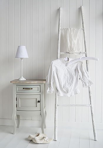 New Hampshire white decorative ladder in bedroom as clothes horse