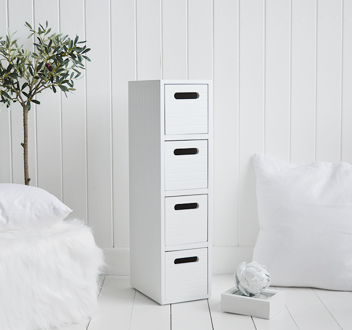 Dorset white very narrow slim white bedside table with 4 drawers for small white bedroom furniture at only 17cm wide. Photograph shows the side and top of the New England style cladding finish