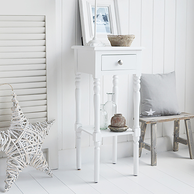 The White Lighthouse bedroom furniture. A narrow white lamp table with drawer and silver handle, The Georgetown range of entry way furniture