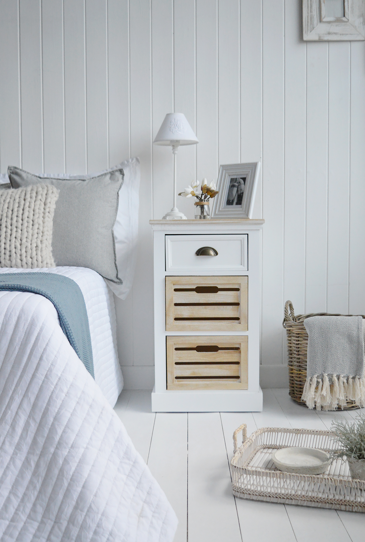 The Southport driftwood and white bedside cabinet with three drawers, suits a New England country or coastal inspired bedroom