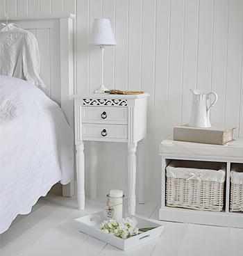 A white bedside table suitable for childrens bedroom