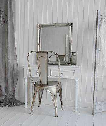Antique silver chair with the New England white dressing table