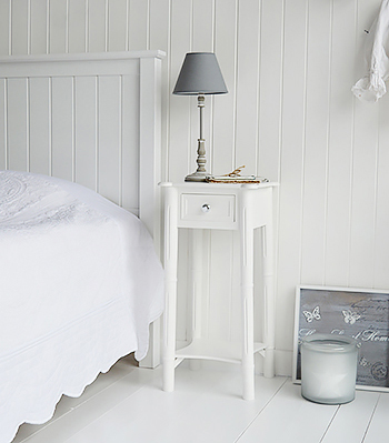 White bedside table with silver handles to match the dressing table