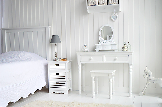 The New England white dresser, showing our loverly white rocking horse to the side. In the white bedroom a white bedside table is a perfect table top for a lamp, phone and glasses.