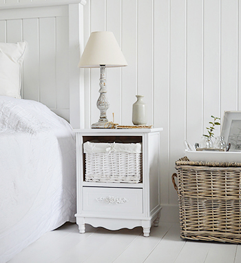 White bedroom furniture and a basket for bedroom decor