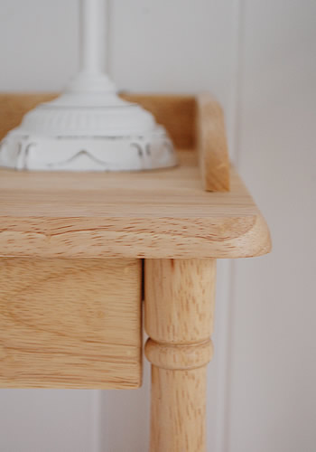 close up to show the finish of the bedside table with drawer