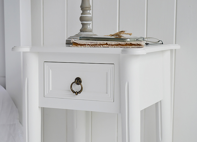Close phot of the drawer and the antique brass handle