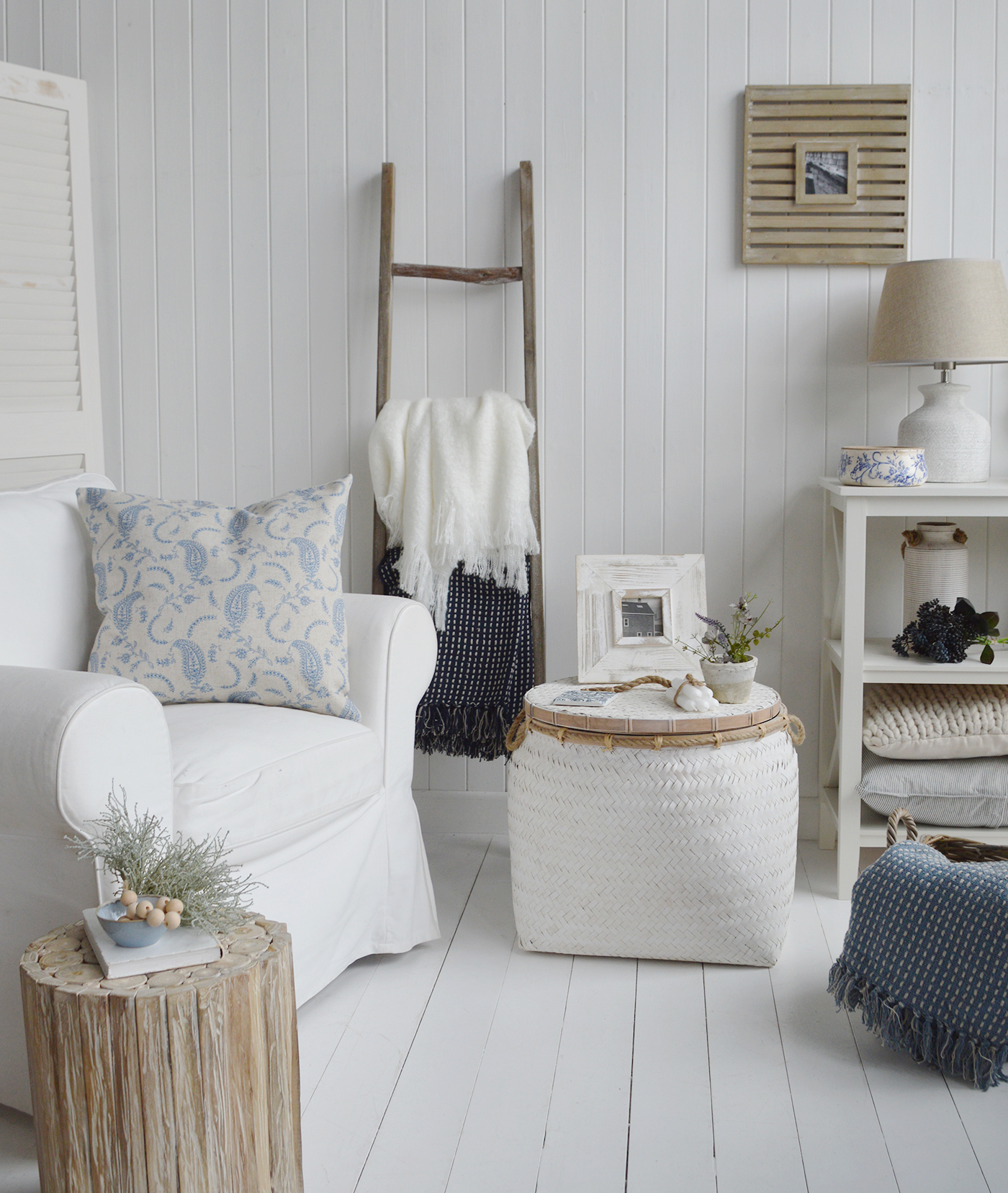 The Nantucket aged white basket table in a blue and white living room for subtly coastal furniture New England Style