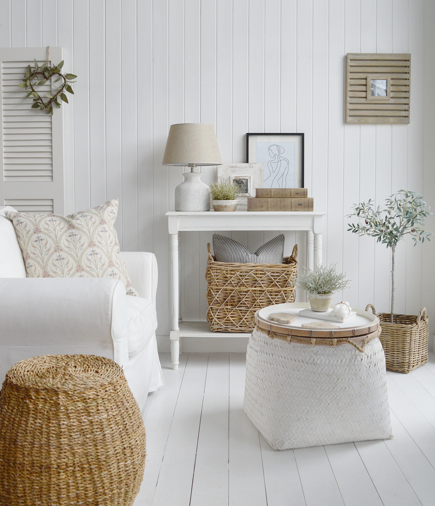 White New England living room with white pieces of coastal and beach house furniture