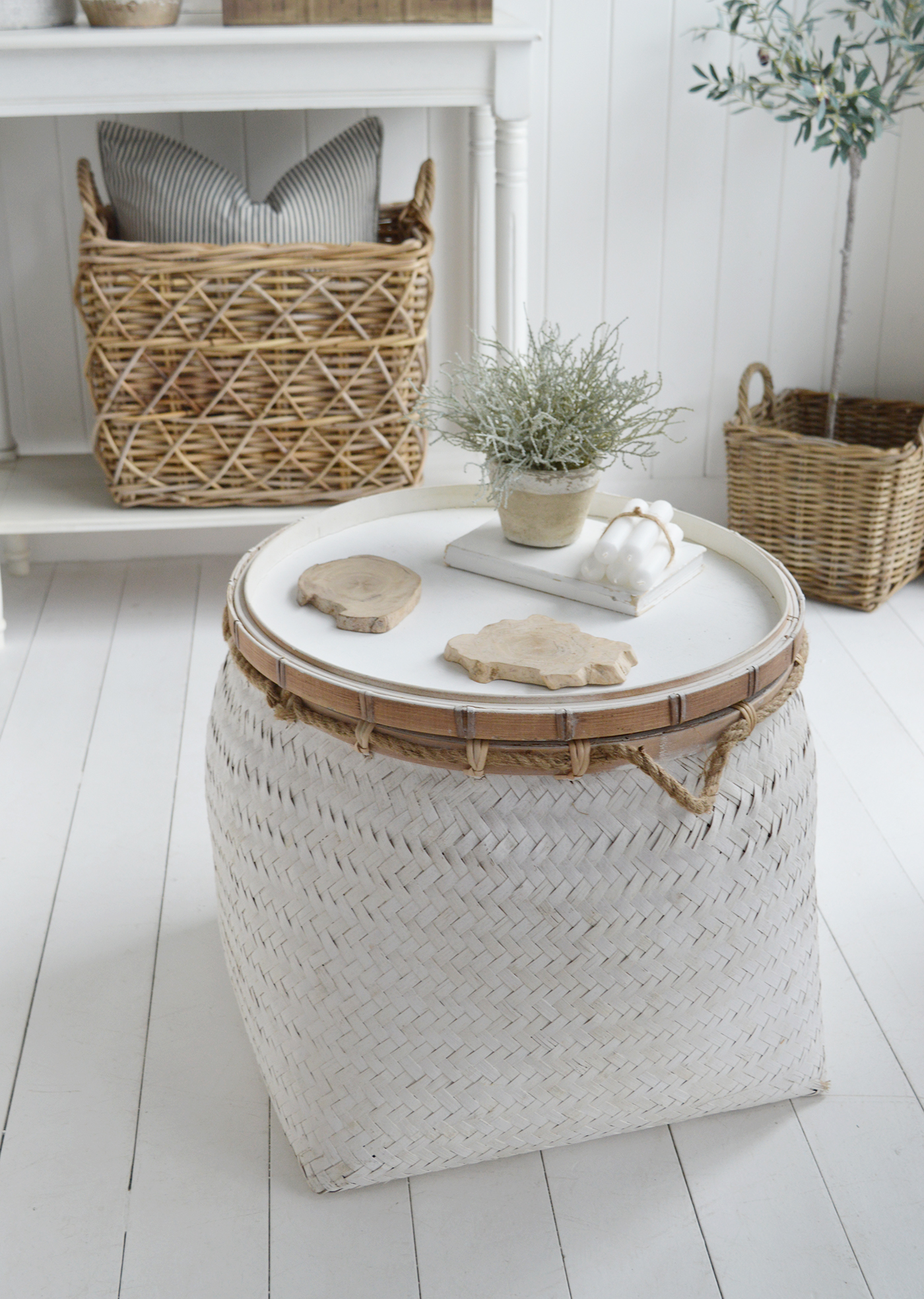 Nantucket white basket as a coffee table in a white New England living room 