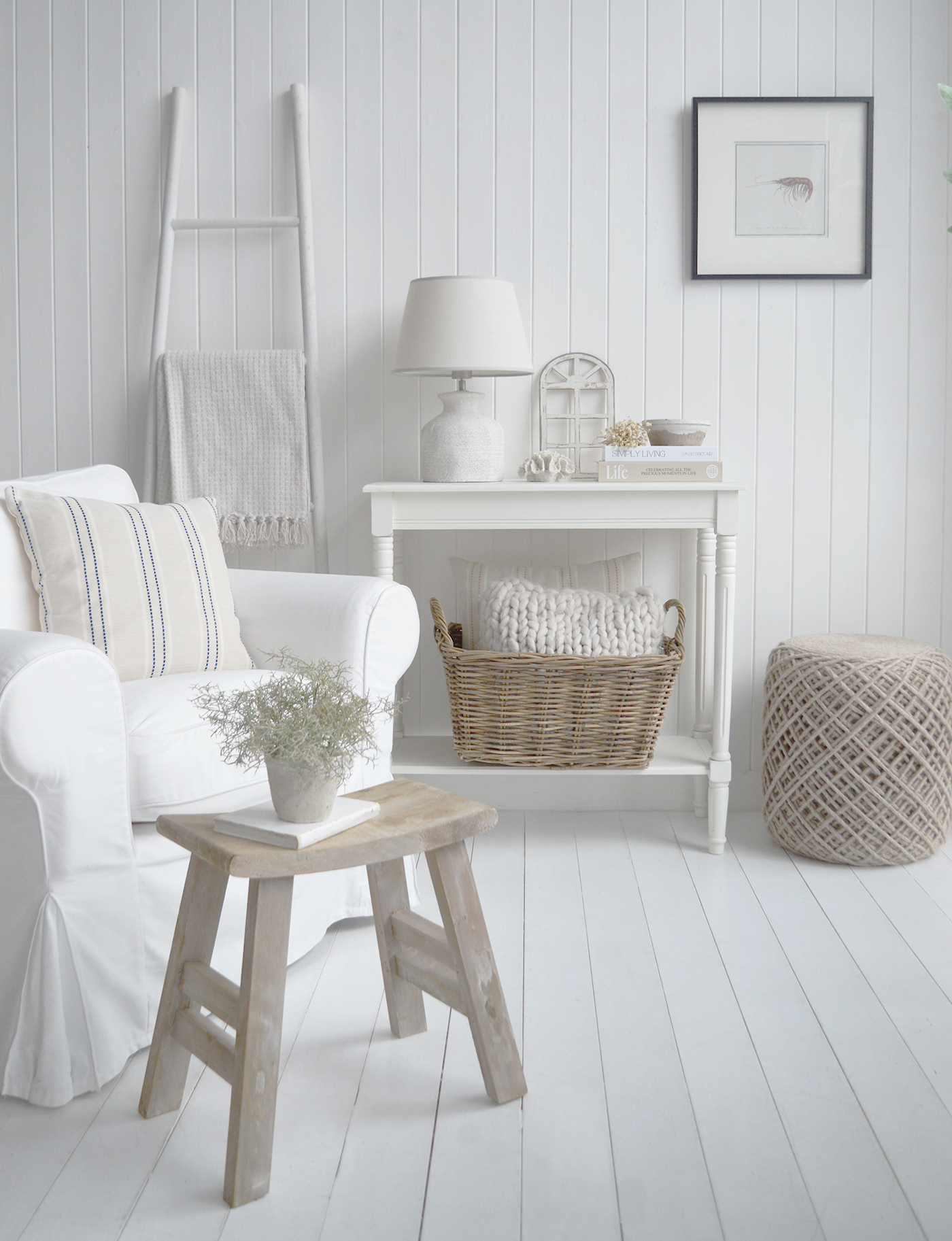 Neutral modern coastal interiors combine white shiplap walls with layered natural textures for a timeless and elegant finish.