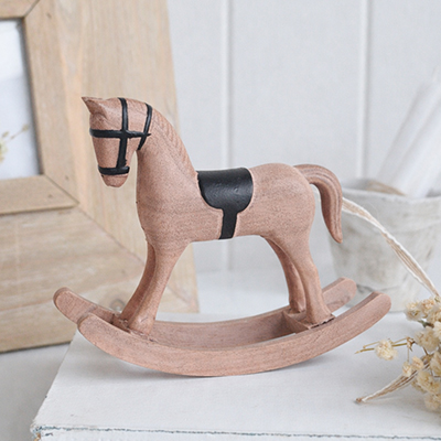 The understated design of this grey rocking horse makes it easy to layer with books, frames and soft furnishings in relaxed interiors.