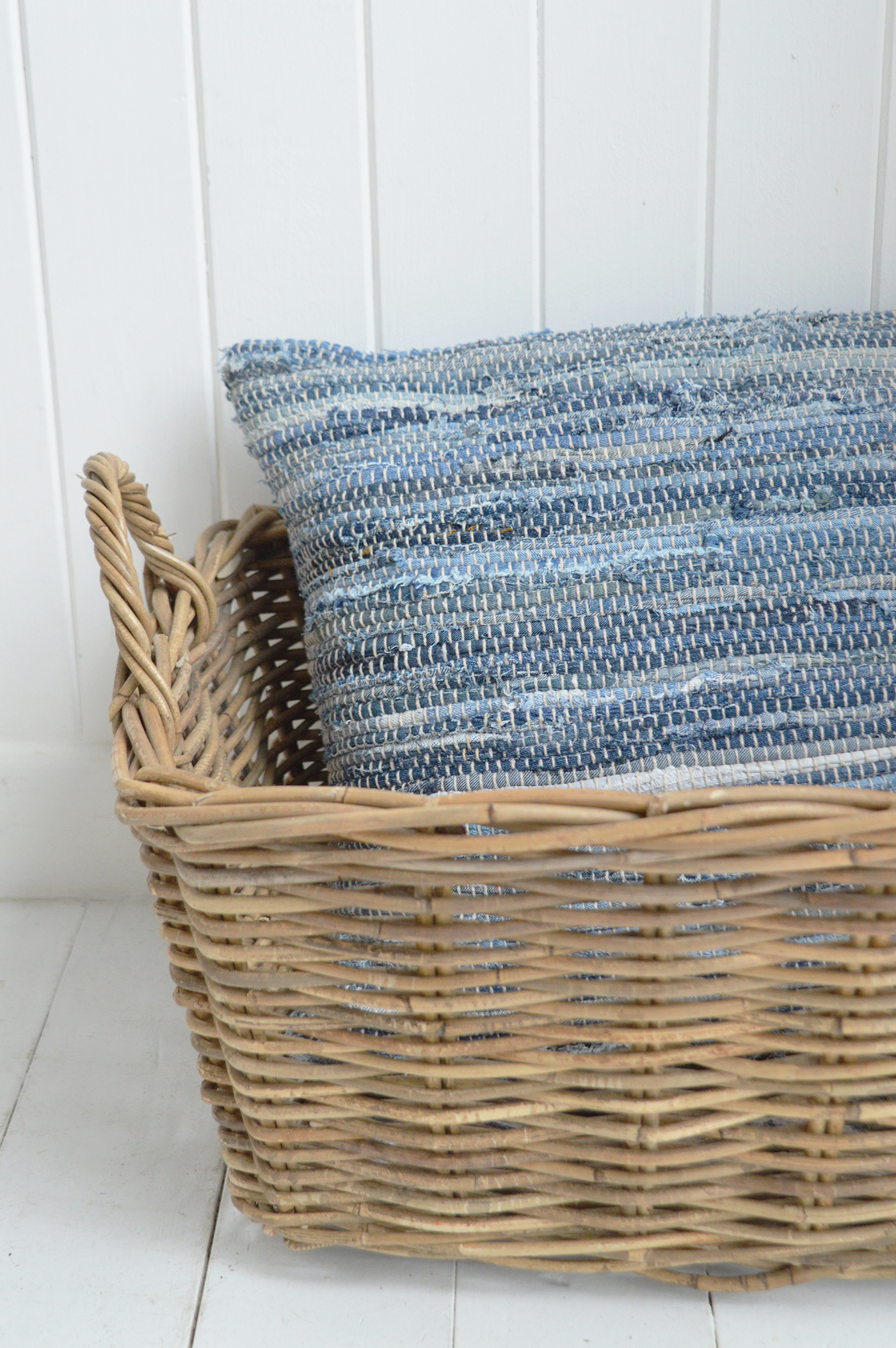 Woven baskets, ceramic vessels and linen fabrics add warmth to white spaces.