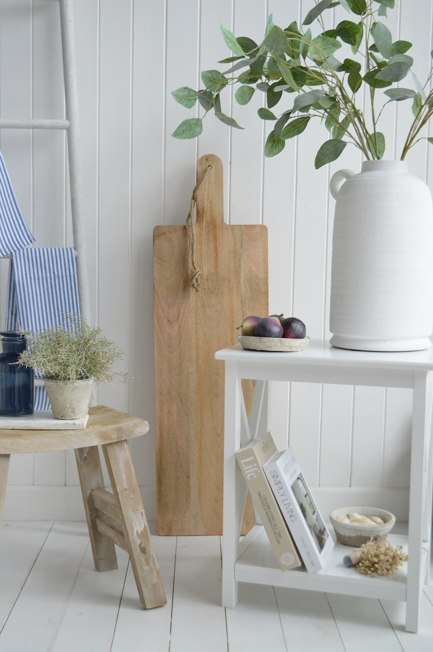 Subtle blue stripes introduce a refined New England influence without feeling themed.