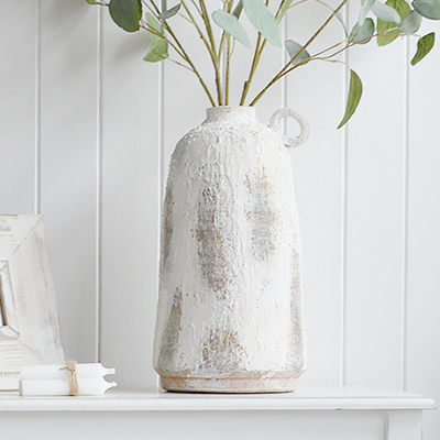 The Hamden Rustic White Vase is a timeless coastal accent, featuring a softly textured, weathered white finish that brings relaxed New England beach house style to shelves, consoles and tables.