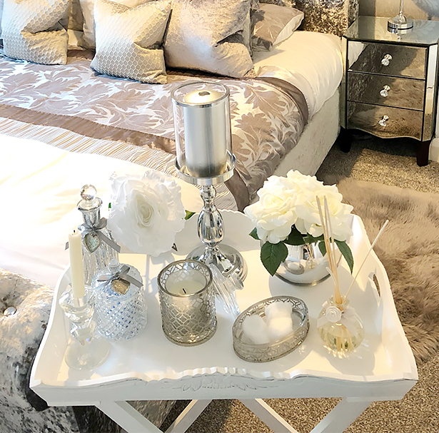 The photograph shows the White butler tray in a gorgeous bedroom with home decor accessories for white bedroom furniture